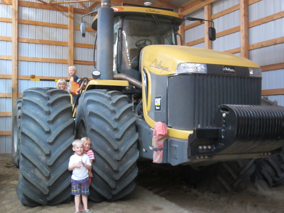 Adrian's kids and a couple of friends love being around the farm. They are taught early NEVER to go around running equipment!